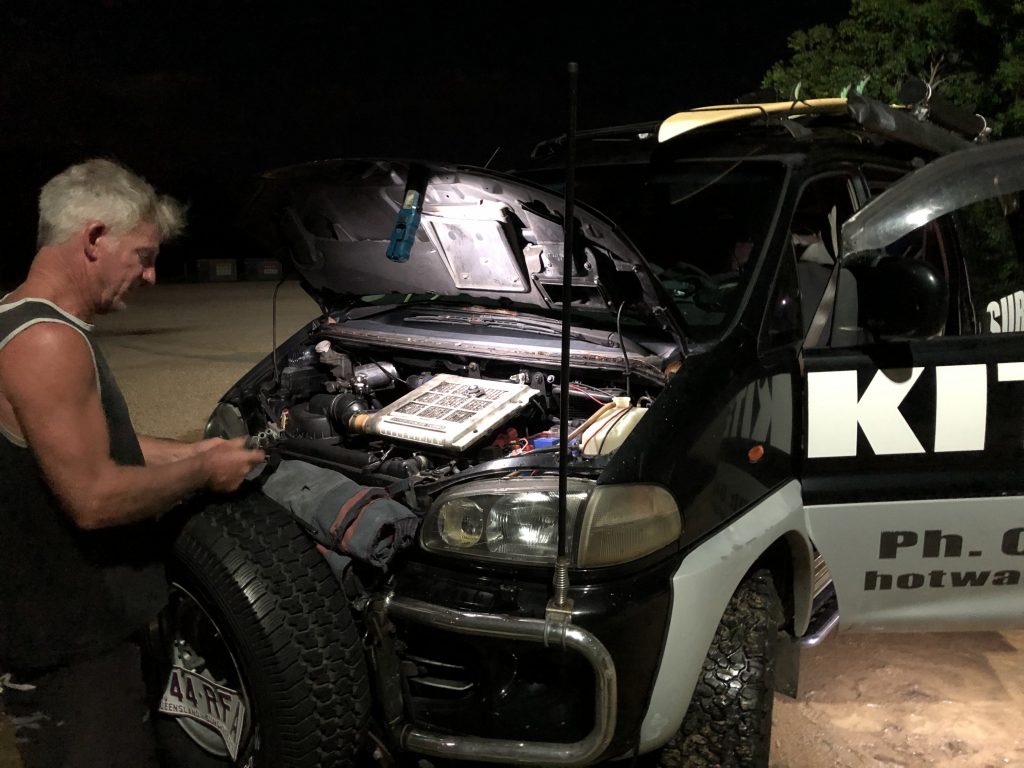 Brian fixing the overheated car