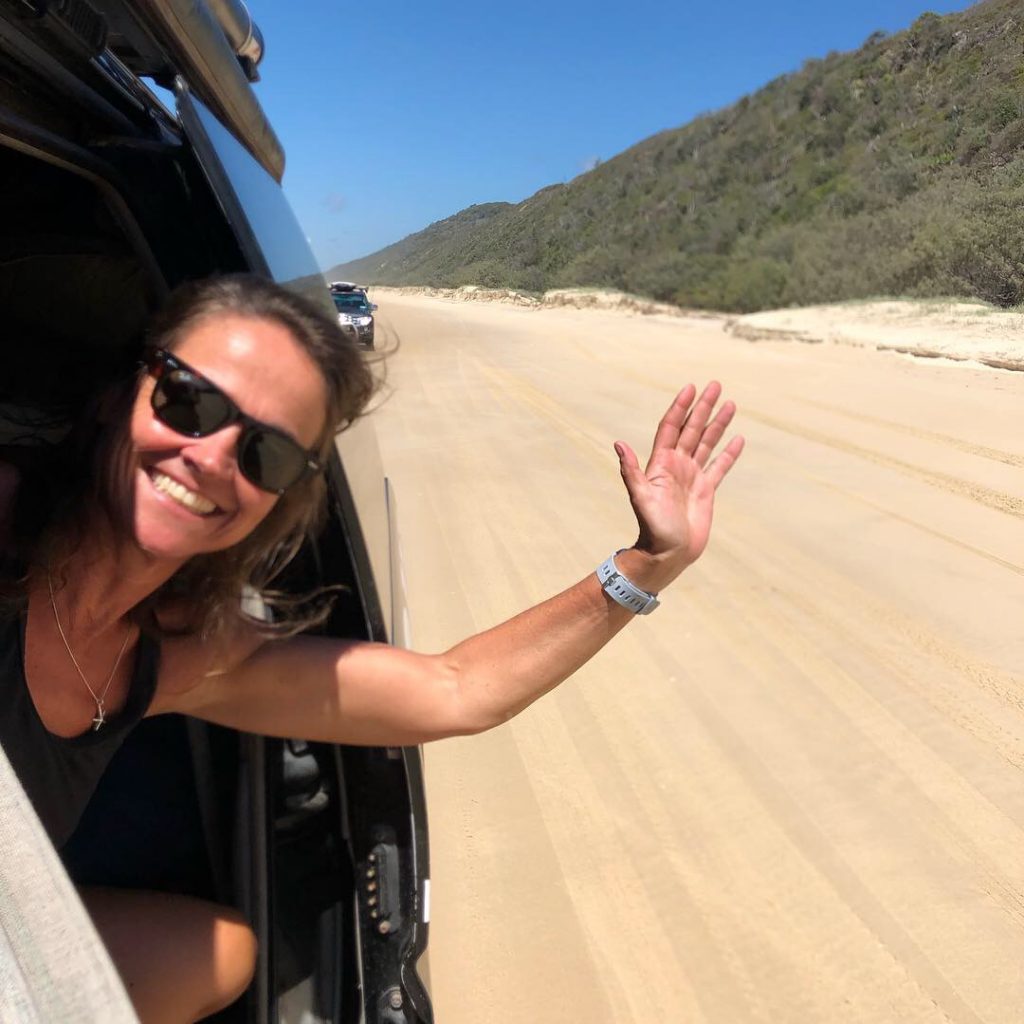 Driving along the beach road in Great White Sandy National Park during a safari in Australia