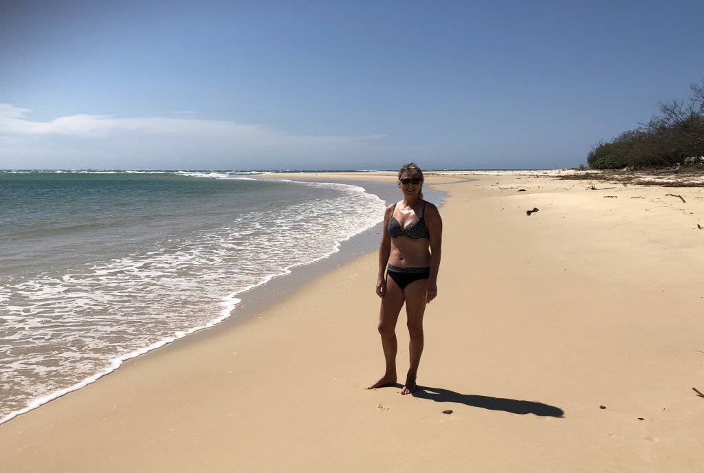 Mary at the shoreline, soaking up the sun