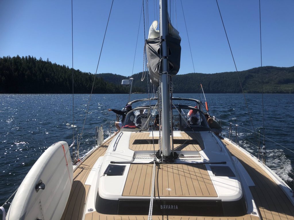 A 45-foot Bavaria yacht sailing on the water in Desolation Sound