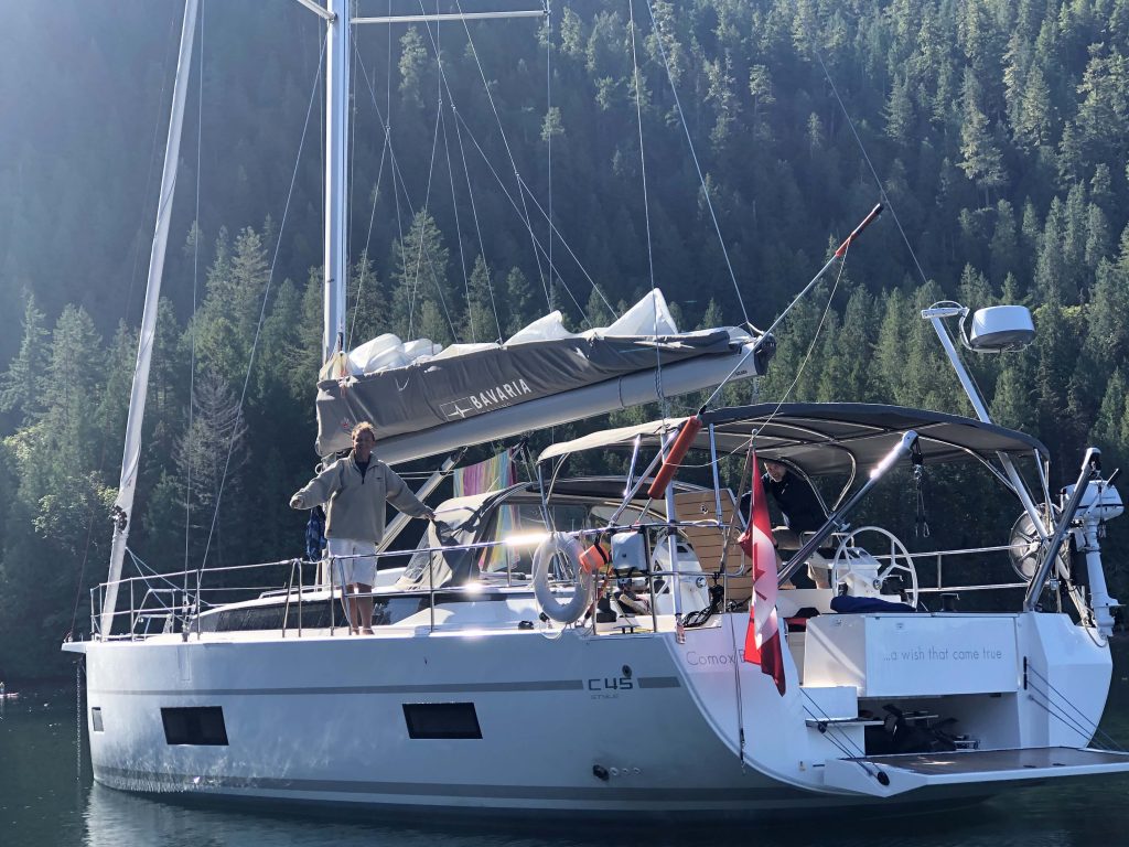 A man aboard a 45-foot Bavaria yacht in Desolation Sound