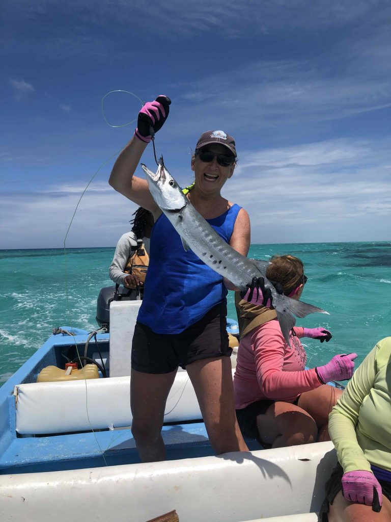 Mary holding a caught barracuda