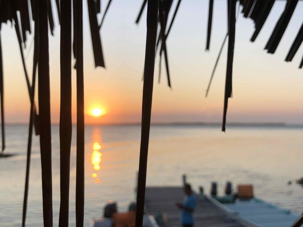 Sunset over Tobacco Caye with Island Expeditions Belize