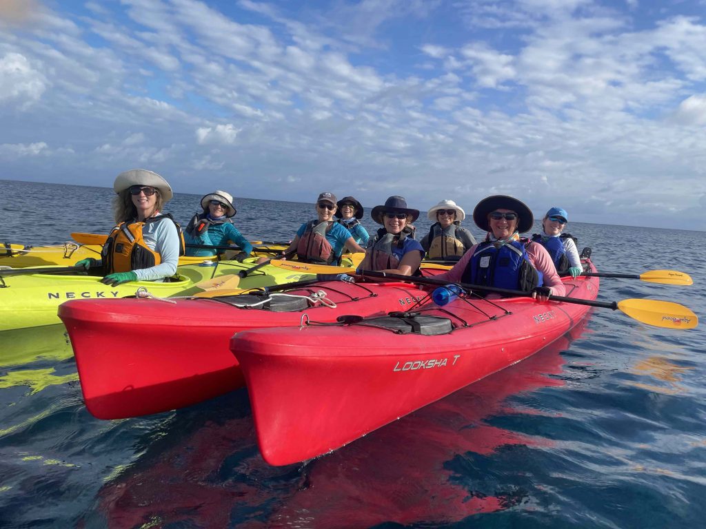 Island Expeditions Belize with women in red and yellow kayaks